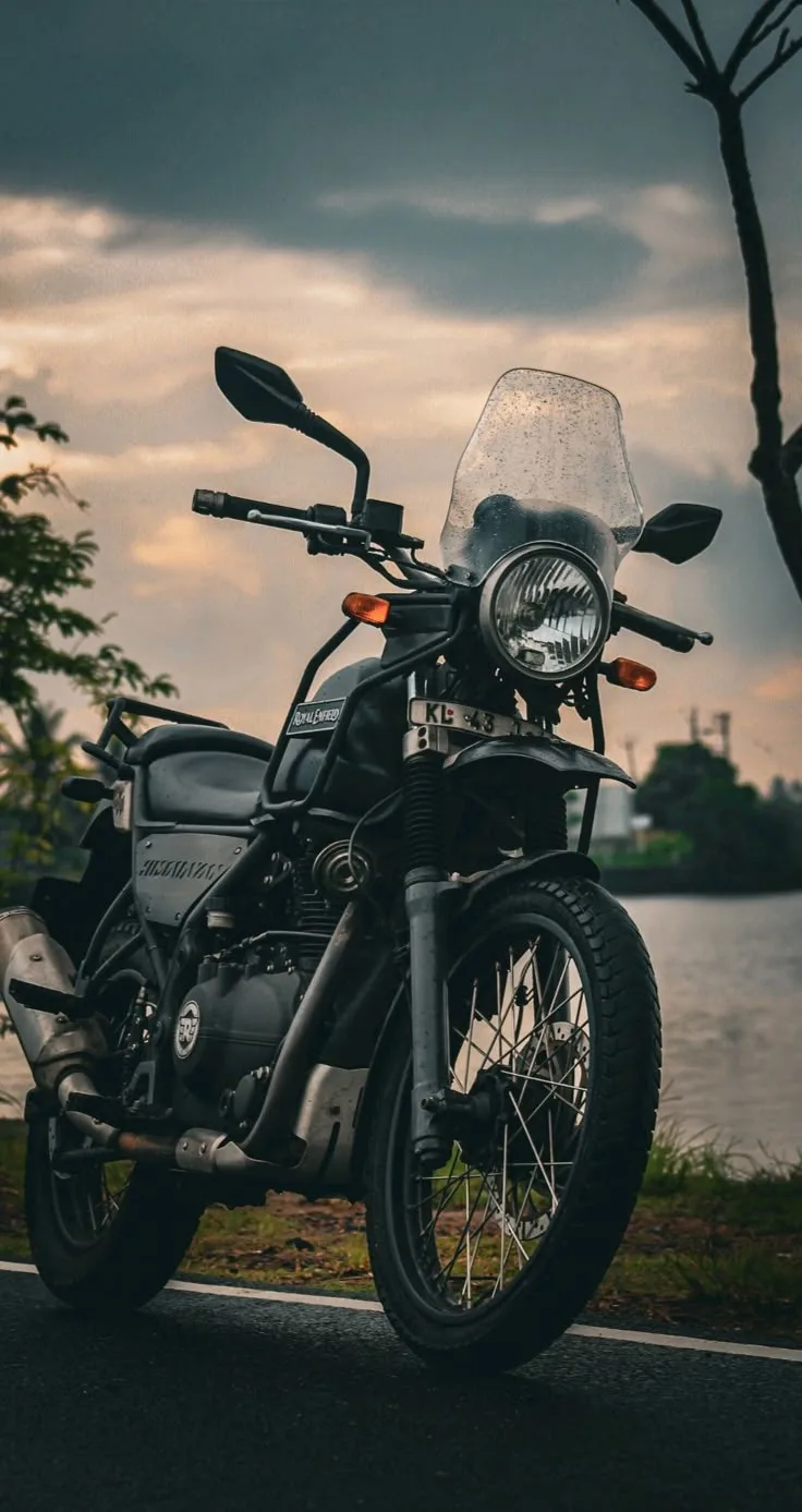 Motorcycle parked on a mountain road near Manali, Himachal Pradesh